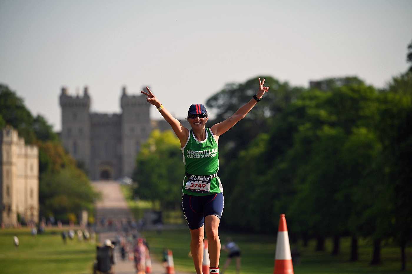A Team Macmillan triathlete celebrating on the Long Walk at Windsor