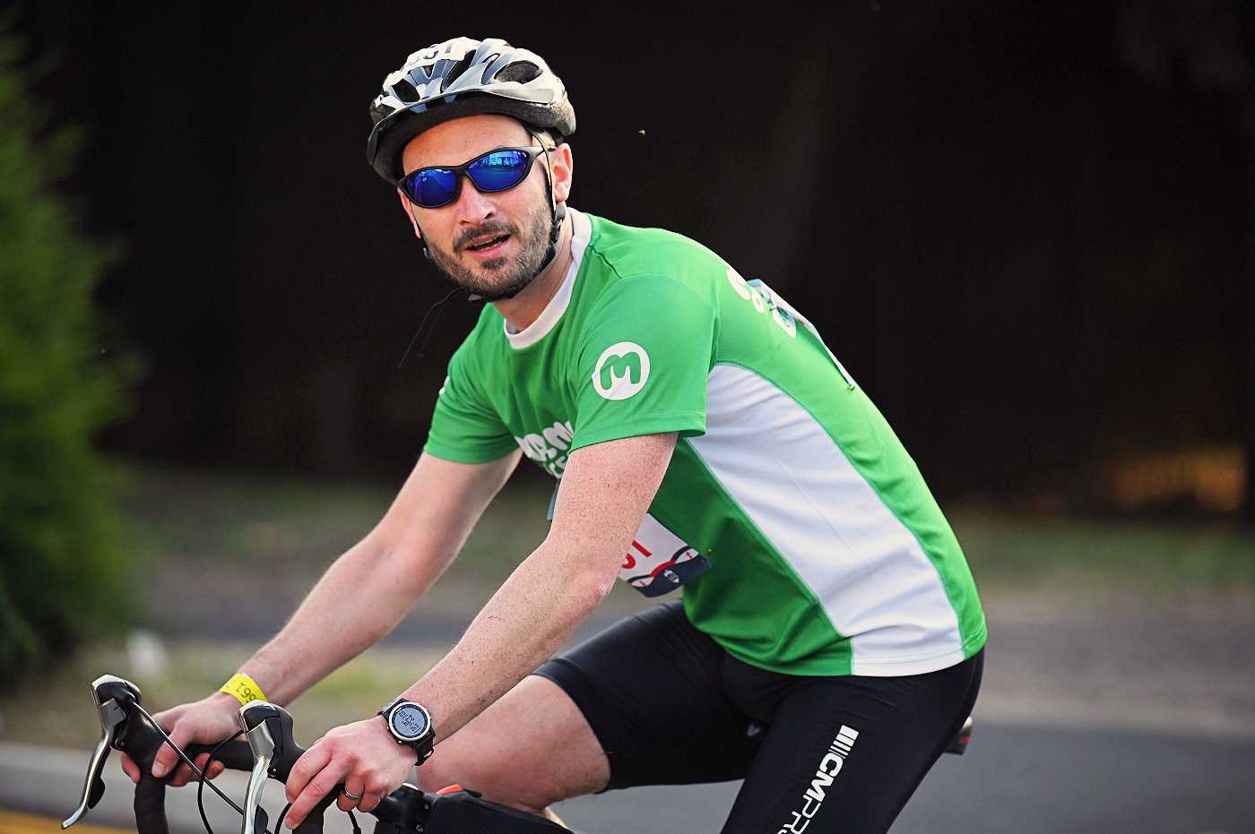 A Team Macmillan triathlete on the bike