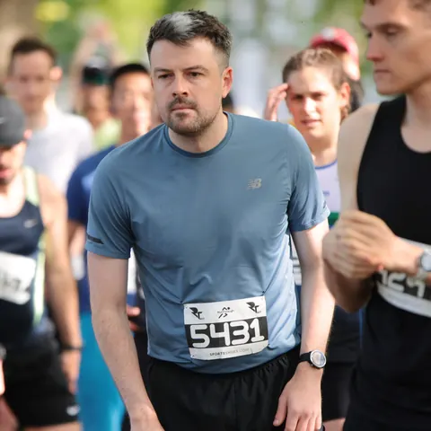 Runners on the start line wearing their race numbers